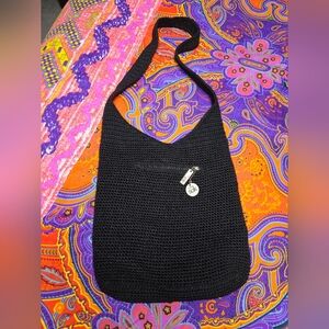 The Sak Black Crochet Hobo Bag with Silver Logo Charm & Exterior Zip